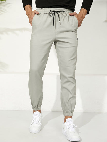 Letter Patched Drawstring Waist Tapered Pants