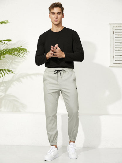 Letter Patched Drawstring Waist Tapered Pants