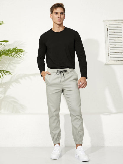 Letter Patched Drawstring Waist Tapered Pants