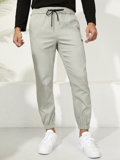 Letter Patched Drawstring Waist Tapered Pants